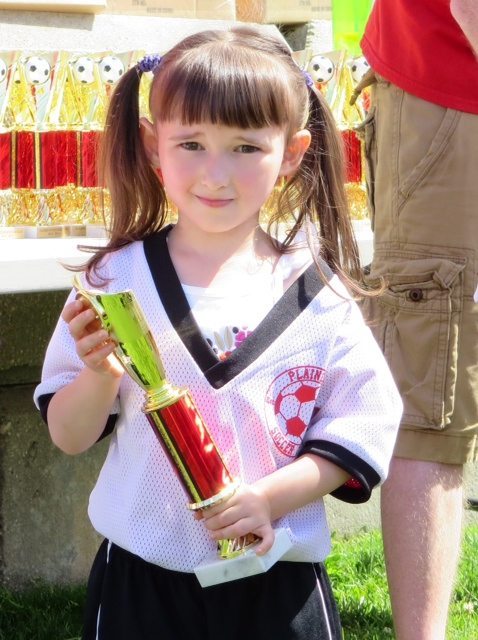 Emma - End of Spring Soccer with her Trophy
