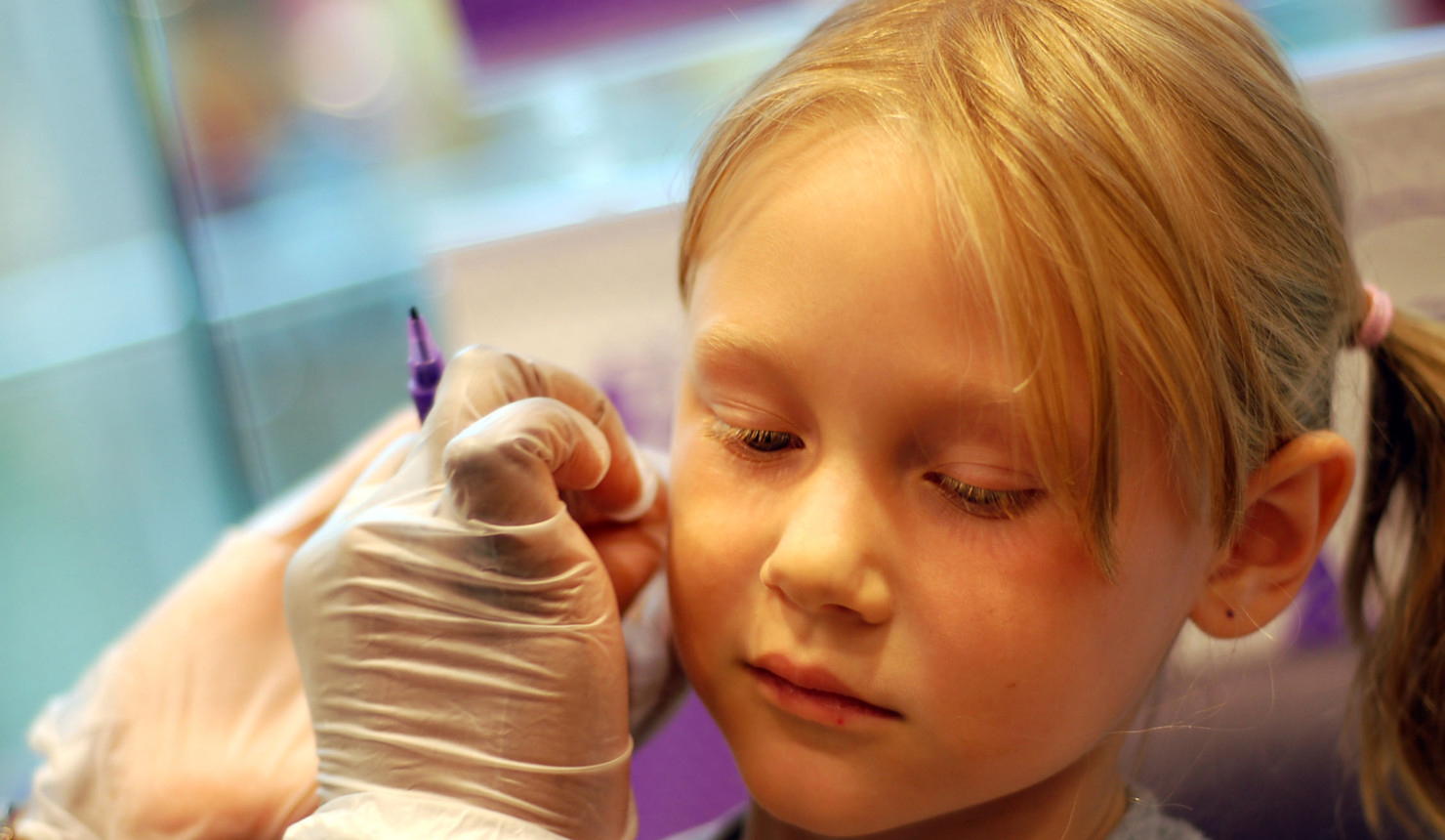 Little Girl Getting Her Ears Pierced