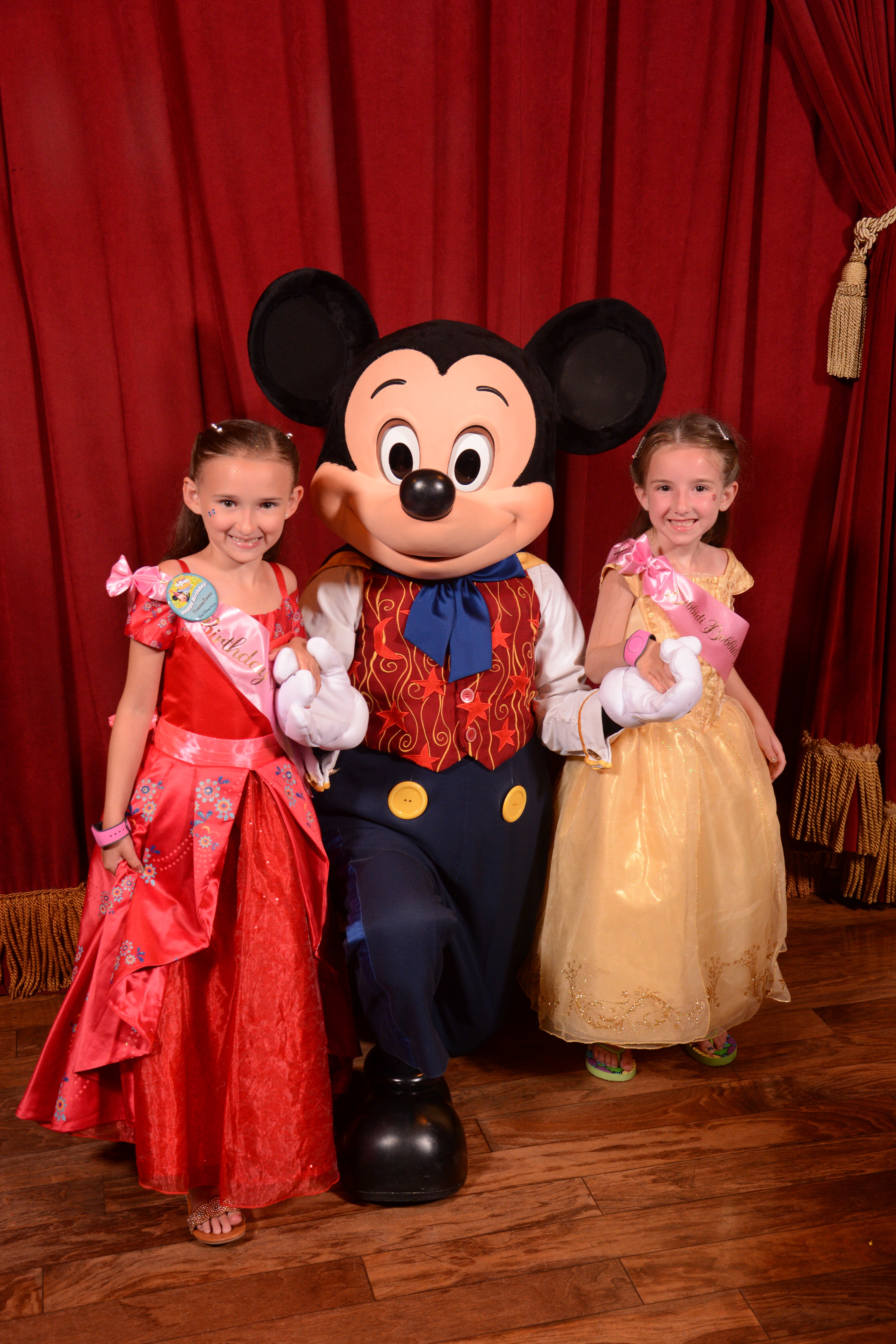 The Girls and Disney Mickey Mouse at Magic Kingdom Town Square