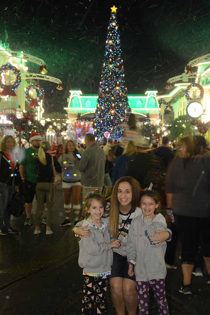 Girls and I in front of Christmas Tree at Magic Kingdom