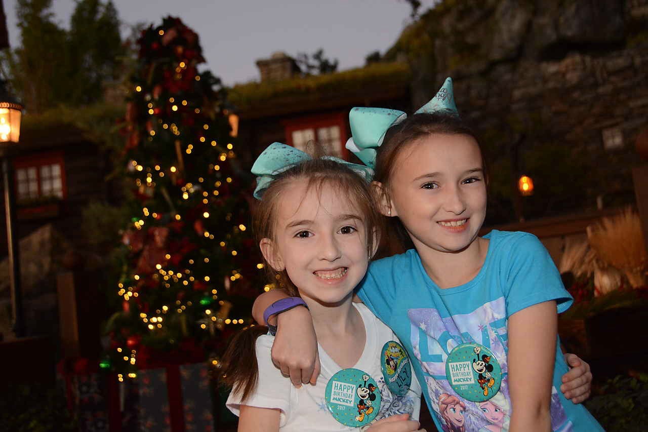 Girls in front of Tree at Epcot in Norway