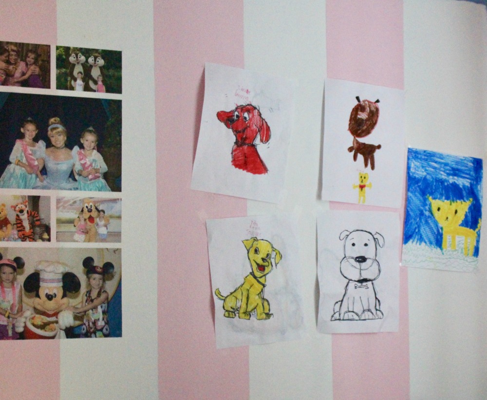 All their artwork hung on their bedroom wall