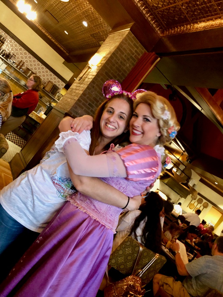 Hugging Rapunzel at The Bon Voyage Breakfast at La Trattoria at the Disneys Boardwalk