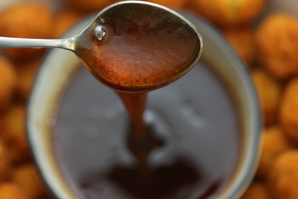 Maple Honey Cinnamon Dipping Sauce Dripping from Spoon